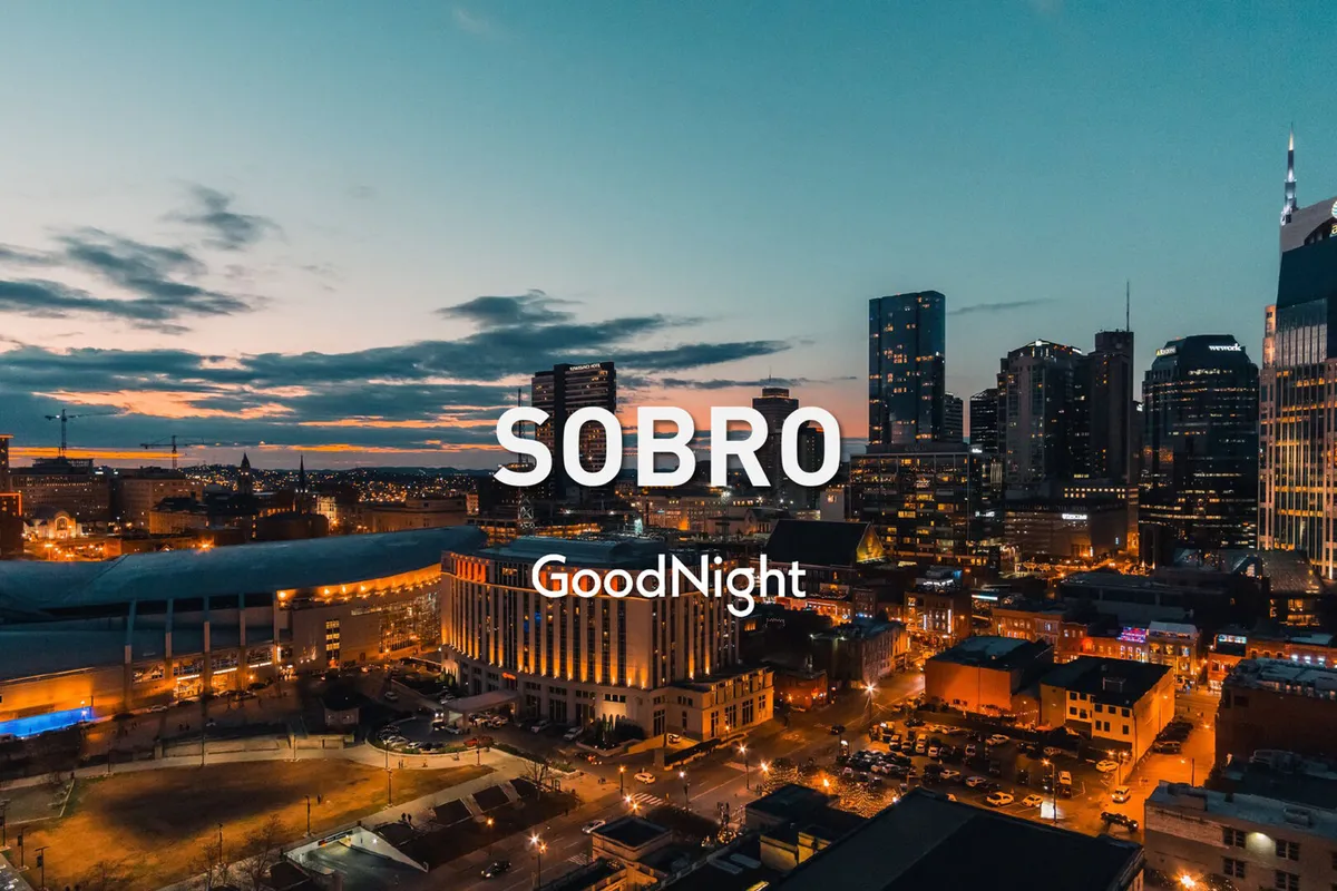 A wide city skyline view at sunset, with glowing buildings and a hint of nightlife awakening. The scene captures Nashville’s urban vibrancy, the promise of evenings spent exploring, and the city’s legendary music and entertainment spots within reach.